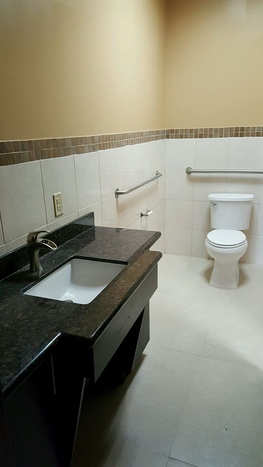 Completed bathroom with new vanity, granite top and grab bars