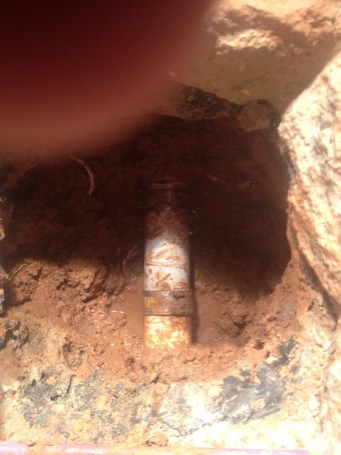 Excavated slab pipe repair underway